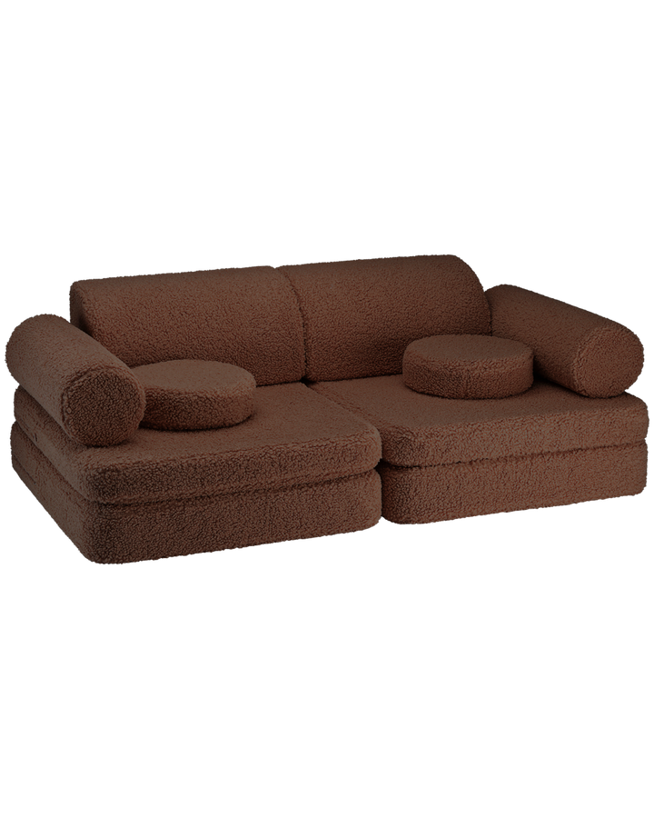 Chocolate brown boucle settee with cylindrical and round cushions