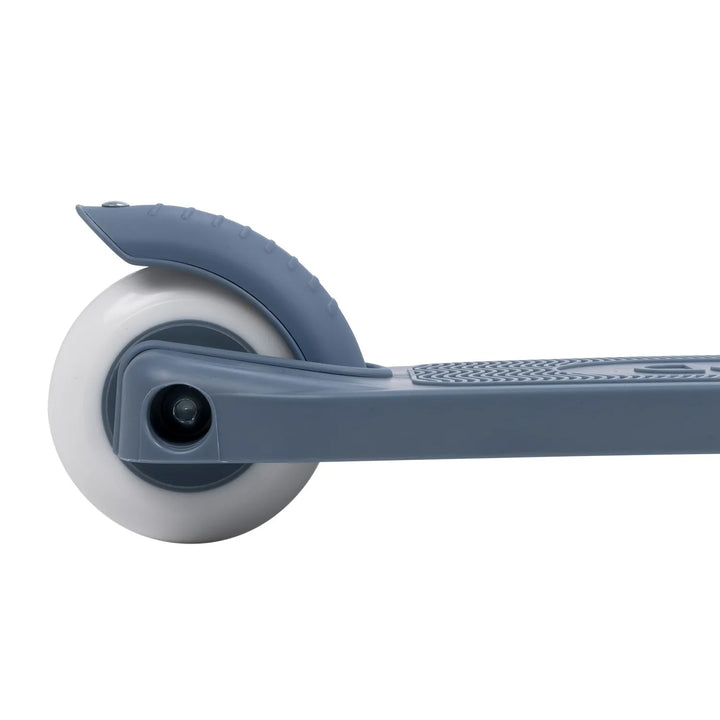 Close-up of white rubber front wheel with blue hub and metal axle assembly