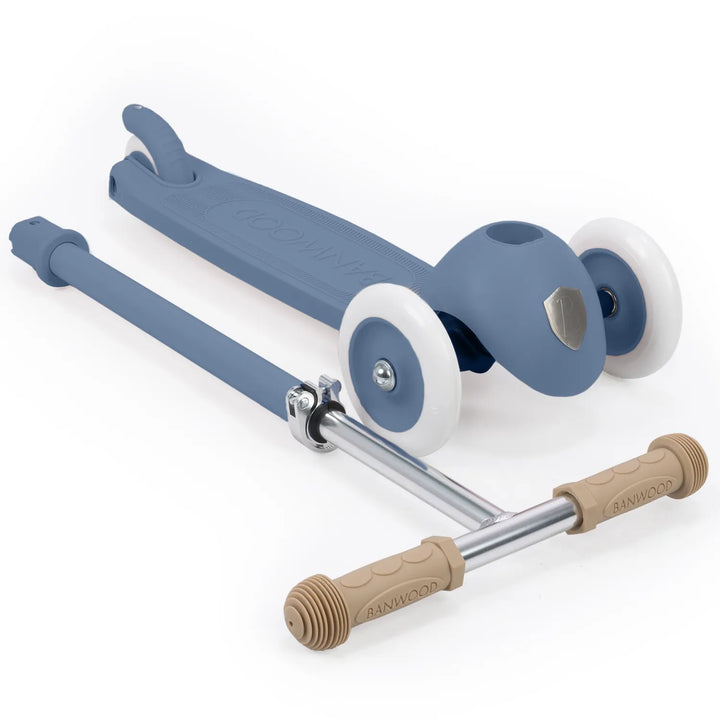 Flat-lay overhead of complete scooter showing wooden handlebar and adjustment mechanism