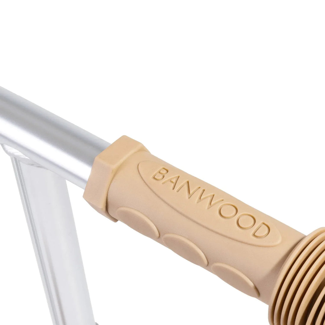 Detail of wooden handlebar grip showing Banwood branding and grooved texture bands