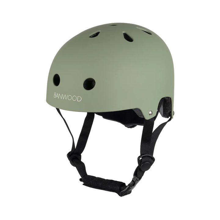 Sage green Banwood helmet with black straps, front and side ventilation holes visible