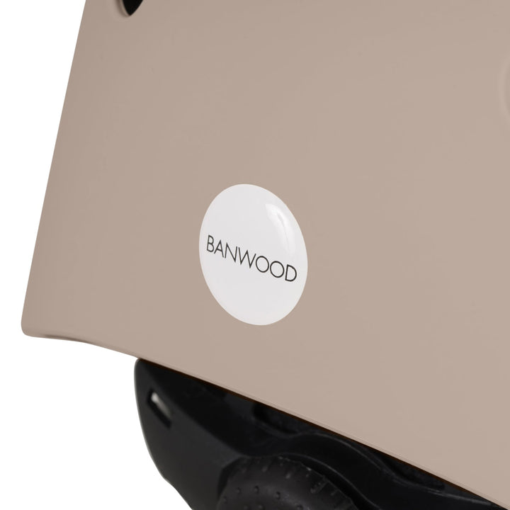 Helmet rear close-up showing white BANWOOD logo on sand shell detail