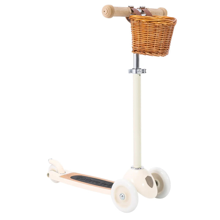 Cream three-wheel scooter with wicker basket and wooden T-bar handlebar, Banwood