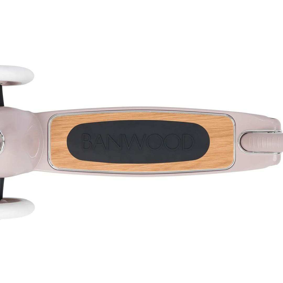 Top-down view of Banwood scooter deck branding and oak finish
