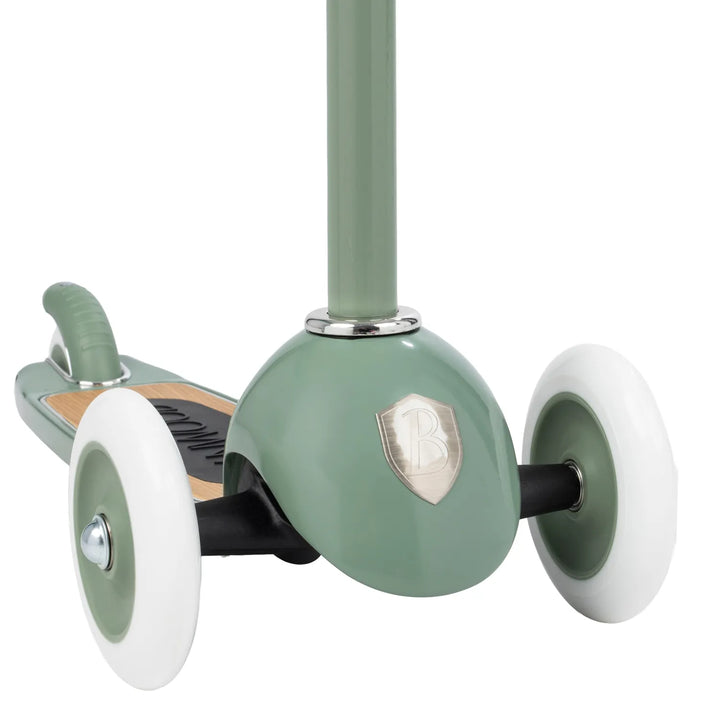 Scooter overhead view showing oak deck branding and triple-wheel positioning