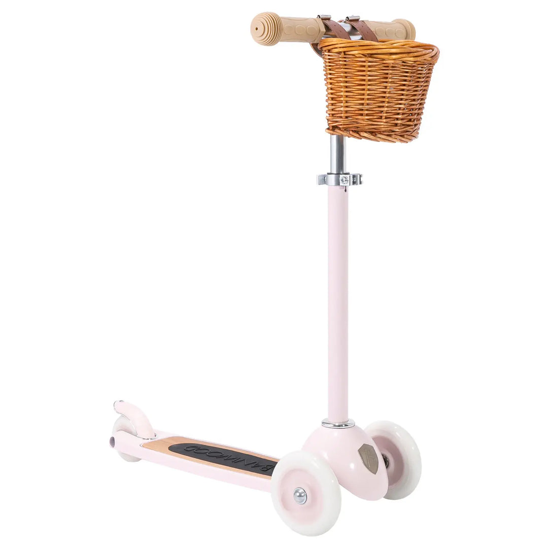 Pink scooter with wicker front basket and wooden T-handlebar, full side profile view