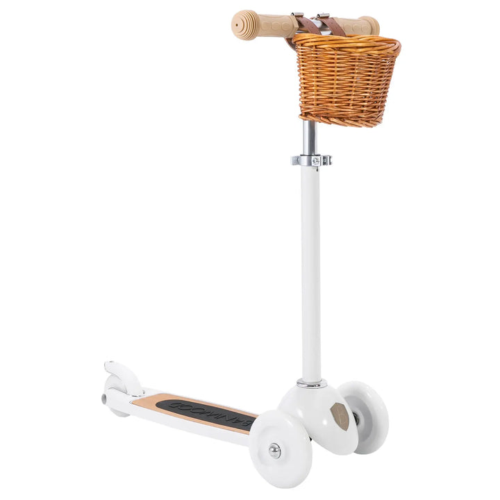 White scooter with wicker front basket and wooden T-bar handlegrips