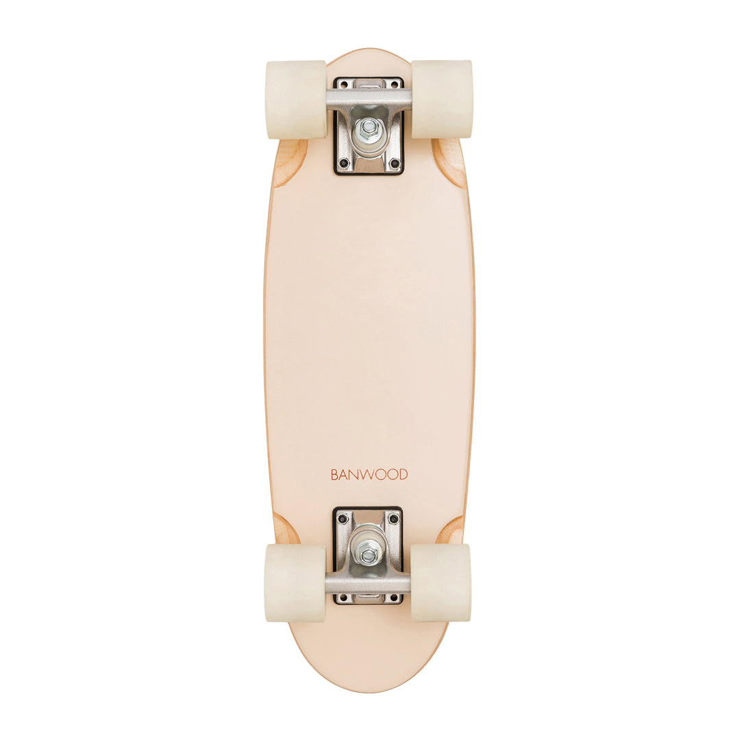 Assembled Banwood skateboard overhead view showing cream wheels and metal trucks