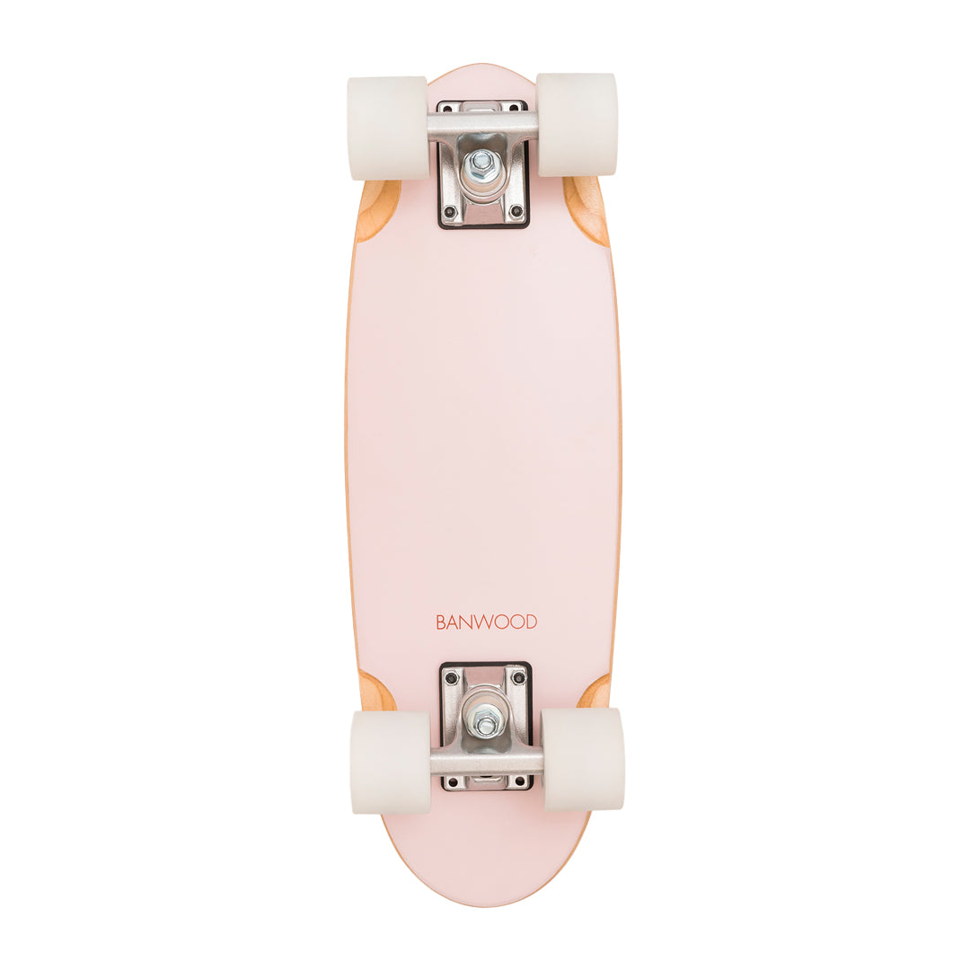 Assembled skateboard bottom view showing white wheels and metal trucks