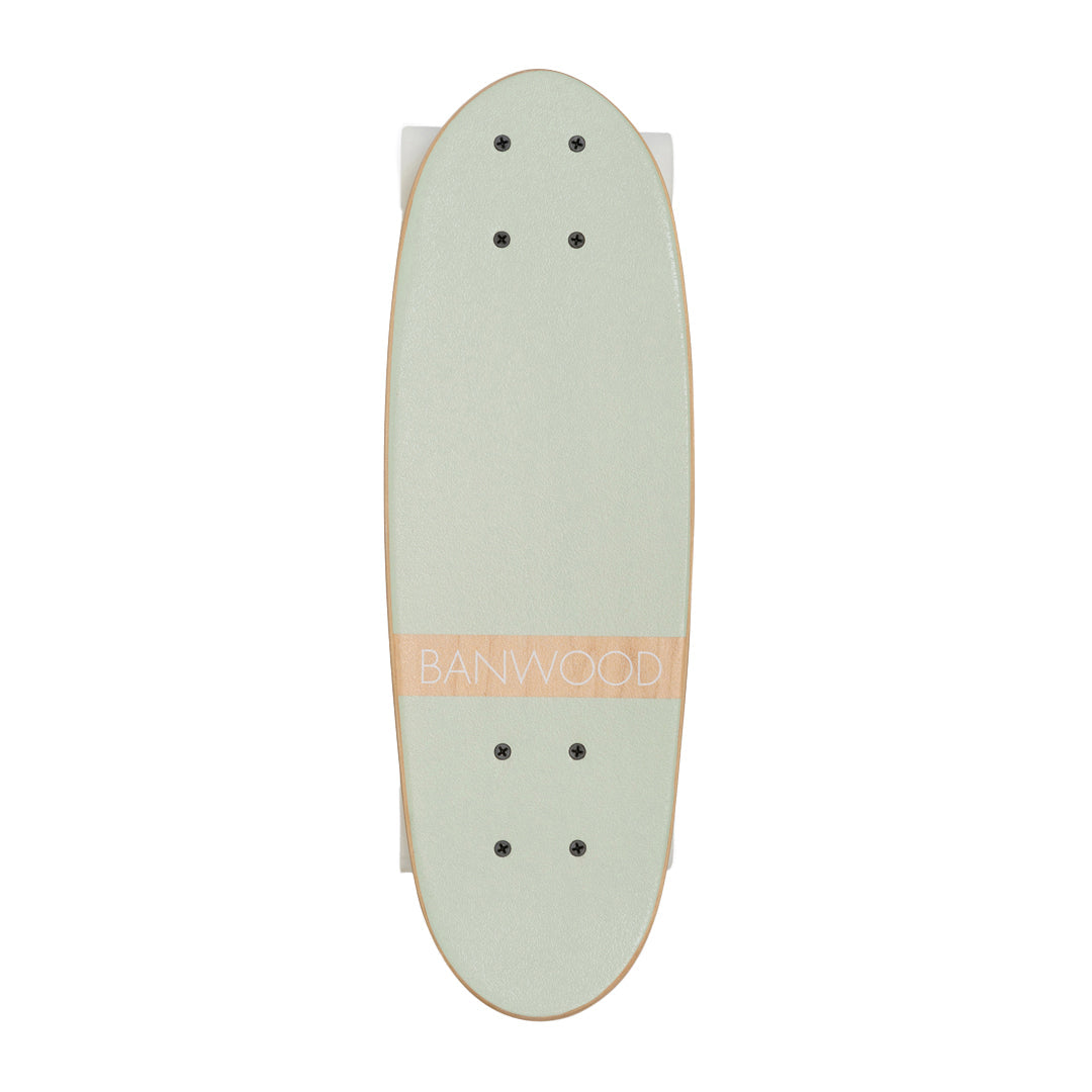 Mint skateboard viewed from above, showing grip tape and mounting holes