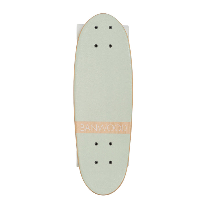 Mint skateboard viewed from above, showing grip tape and mounting holes