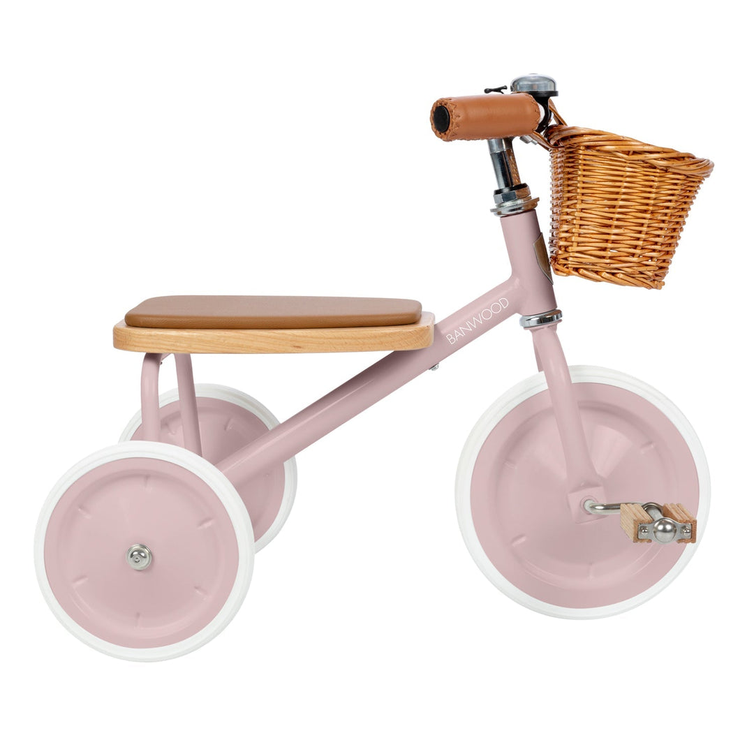 Dusty pink trike side profile with wicker basket and leather handlebar grip, Banwood