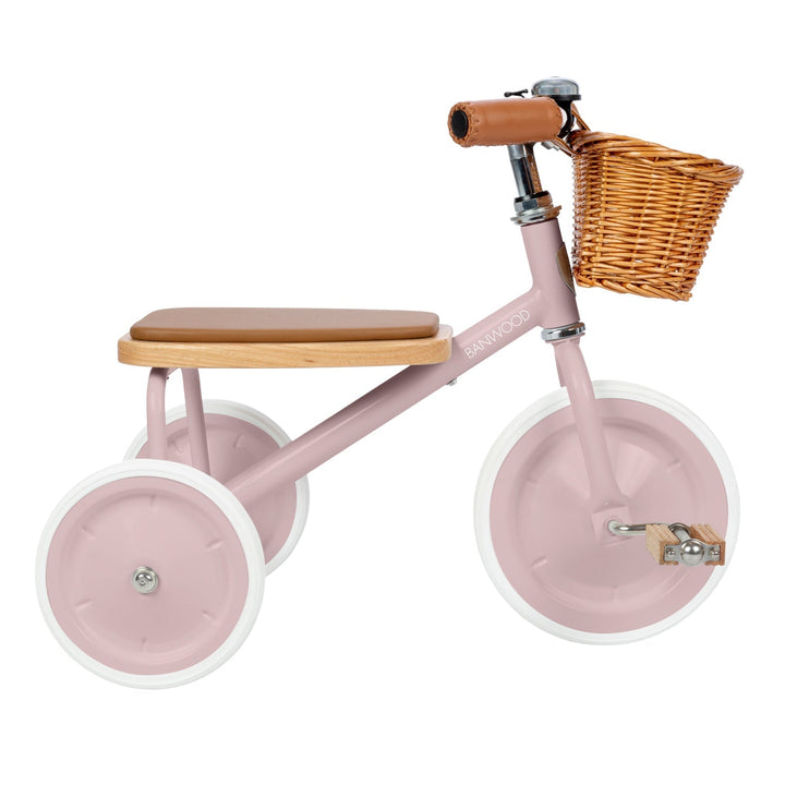 Dusty pink trike side profile with wicker basket and leather handlebar grip, Banwood