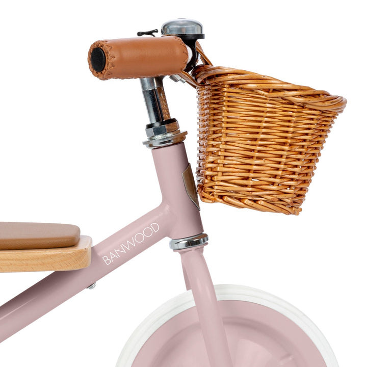 Close-up of leather handlebar grip, safety bell and wicker basket detail, Banwood