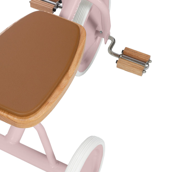 Overhead view of wooden seat base and oak pedal with metal hardware detail, Banwood