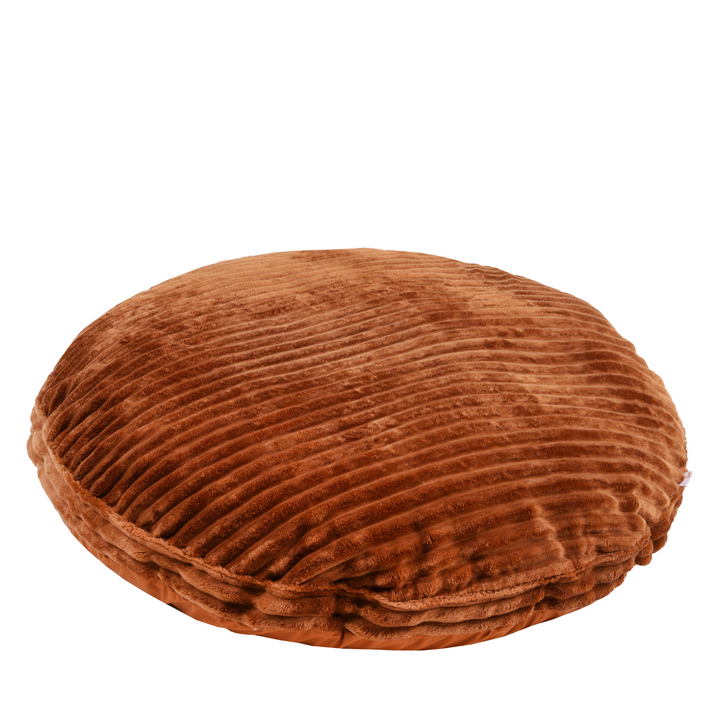 The MINICAMP terracotta corduroy-style floor cushion shown from above, round shape with wide wale ribbed texture