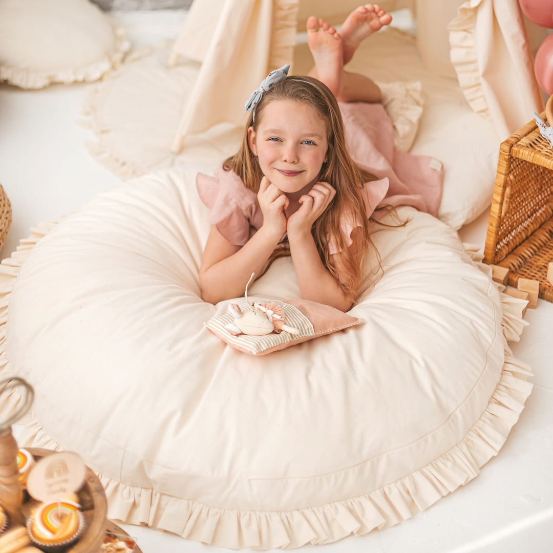 MINICAMP floor cushion with ruffled edges, angled view