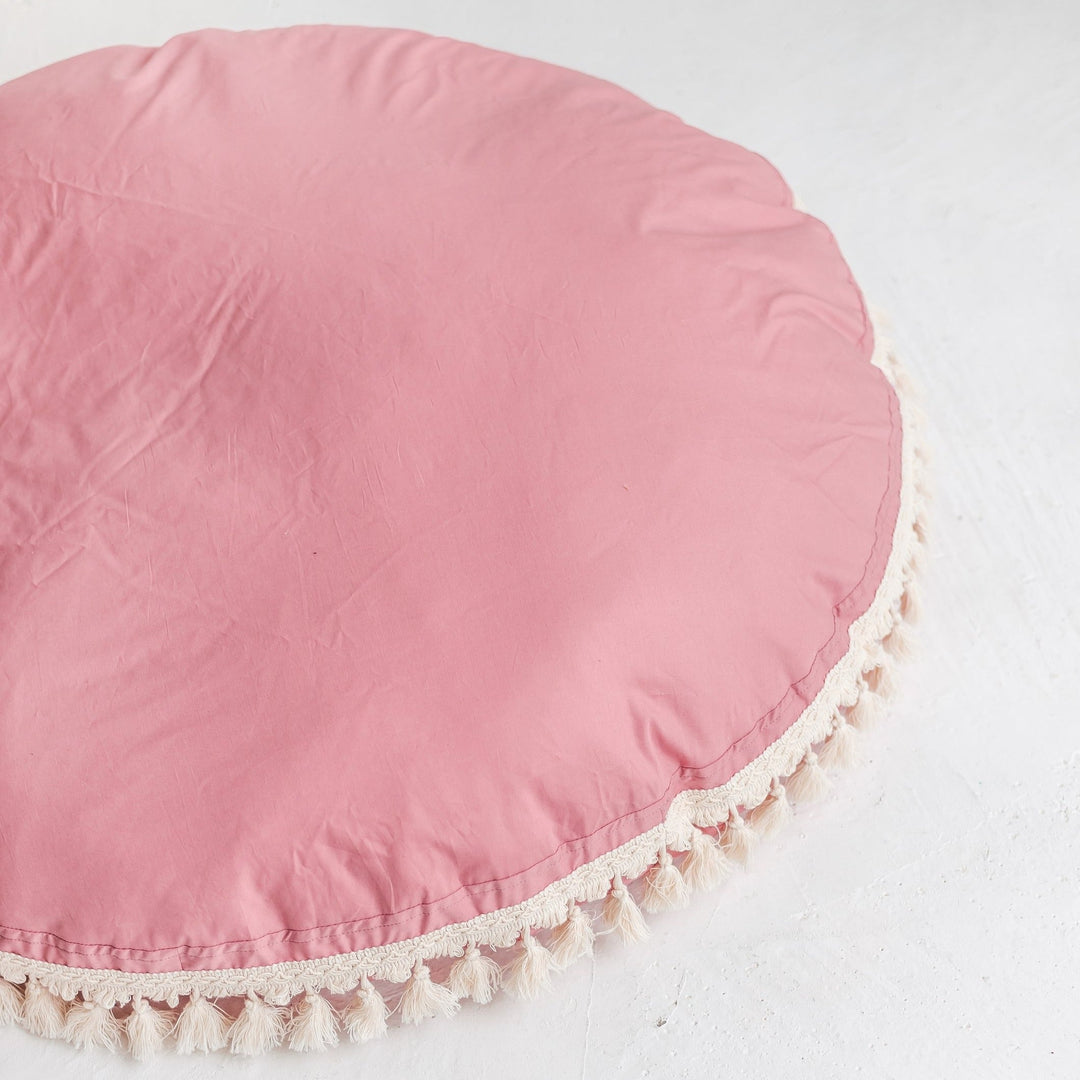 MINICAMP rose tasselled floor cushion, angled view