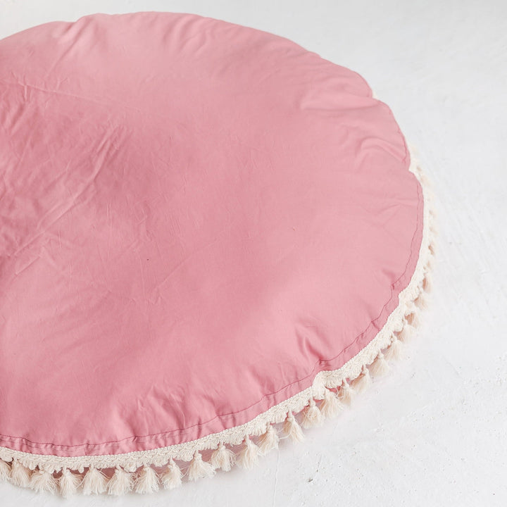 MINICAMP rose tasselled floor cushion, angled view