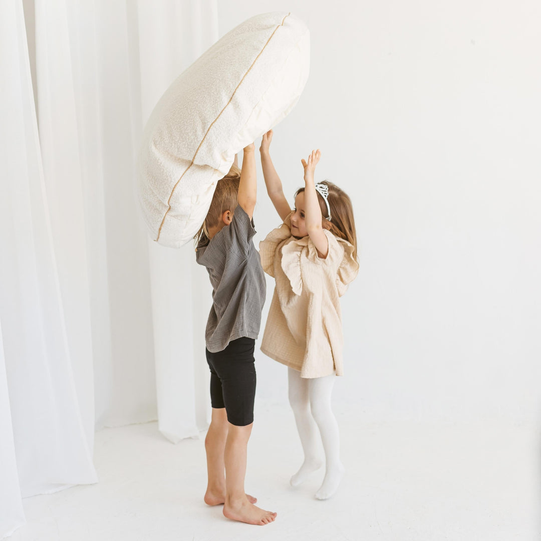 MINICAMP ecru boucle floor cushion, side view