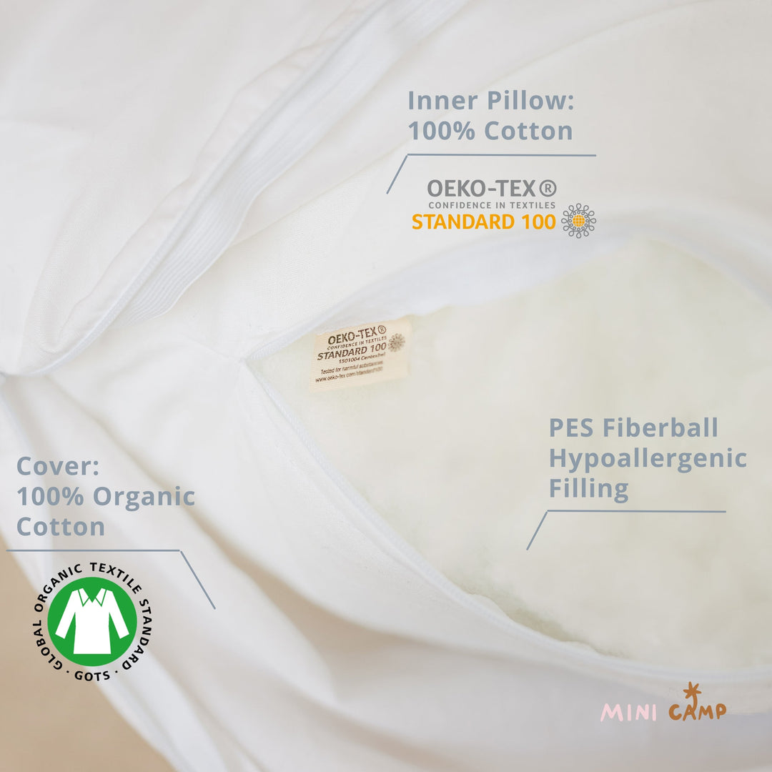 MINICAMP Full Body Maternity Pillow, white organic cotton cover, styled on a bed