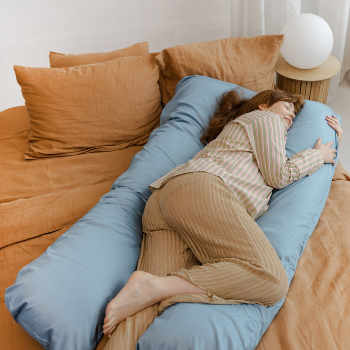 MINICAMP U-shaped pregnancy pillow in stone blue, side view