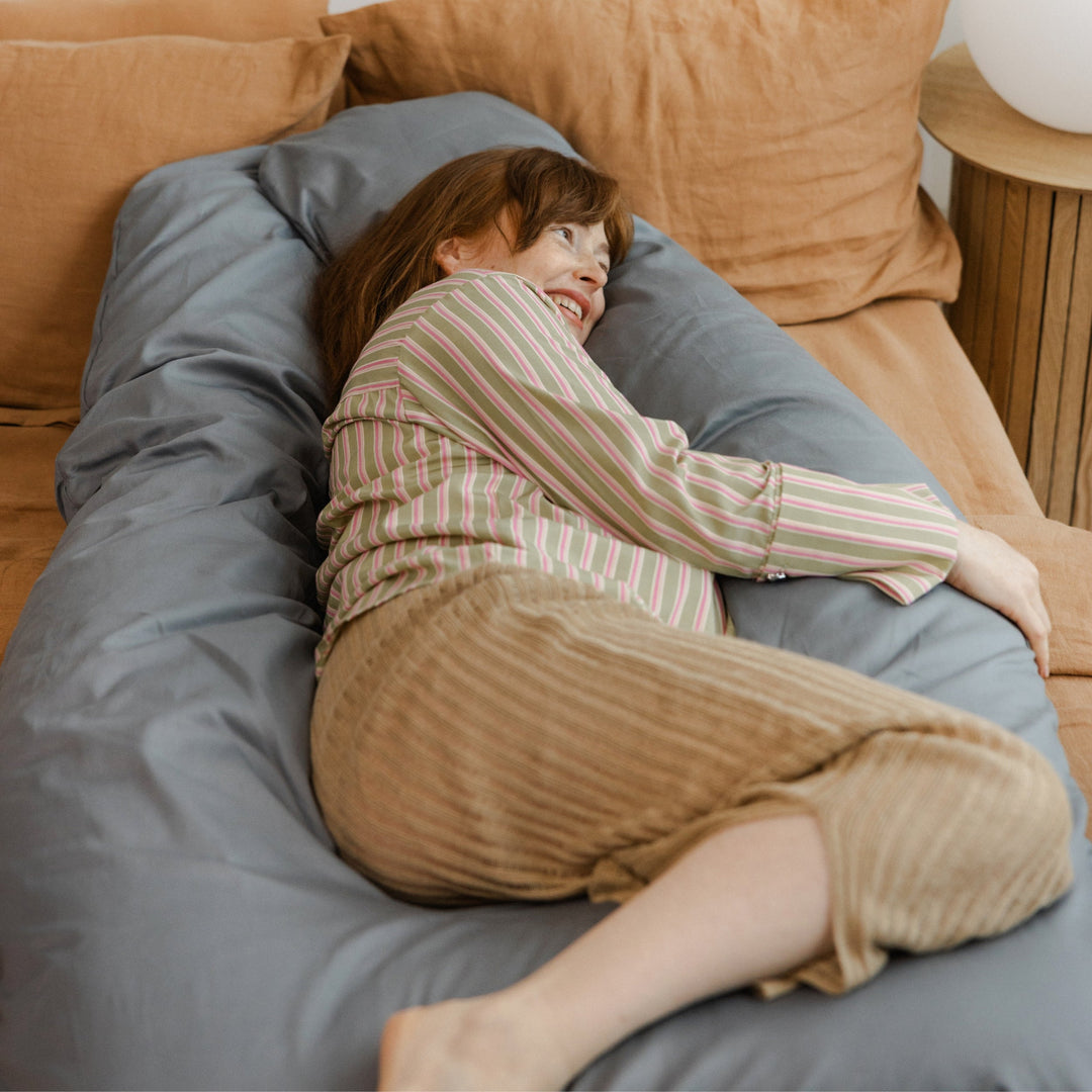 MINICAMP U-shaped pregnancy pillow in stone grey, side view