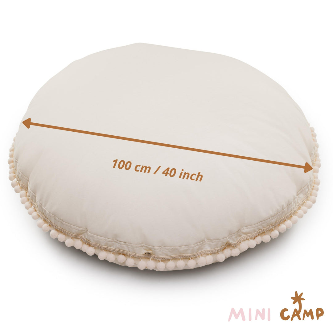 MINICAMP ecru pom pom floor cushion, side view