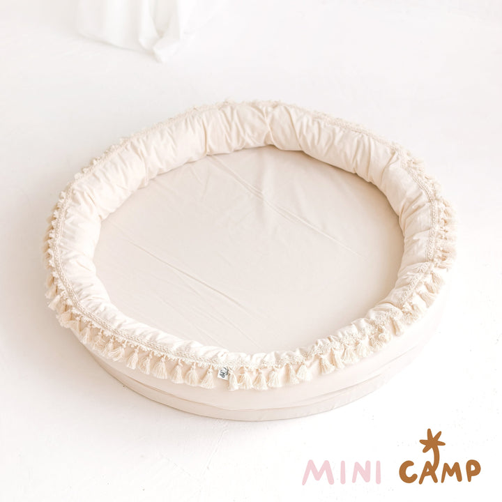 MINICAMP Large Round Nest Play Mat and Kids Lounger in Ecru, studio product photograph