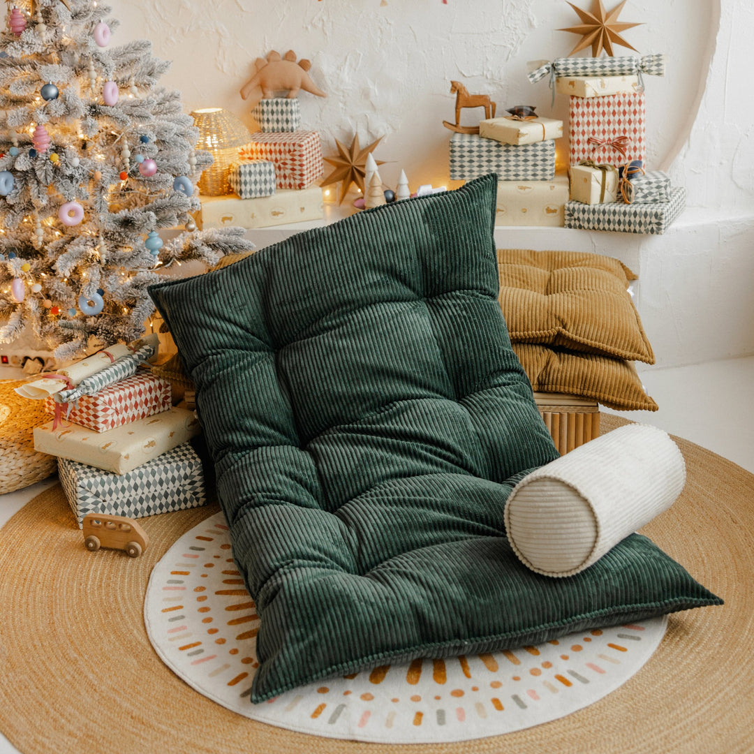Close view of the tufted construction on the MINICAMP petrol green floor cushion