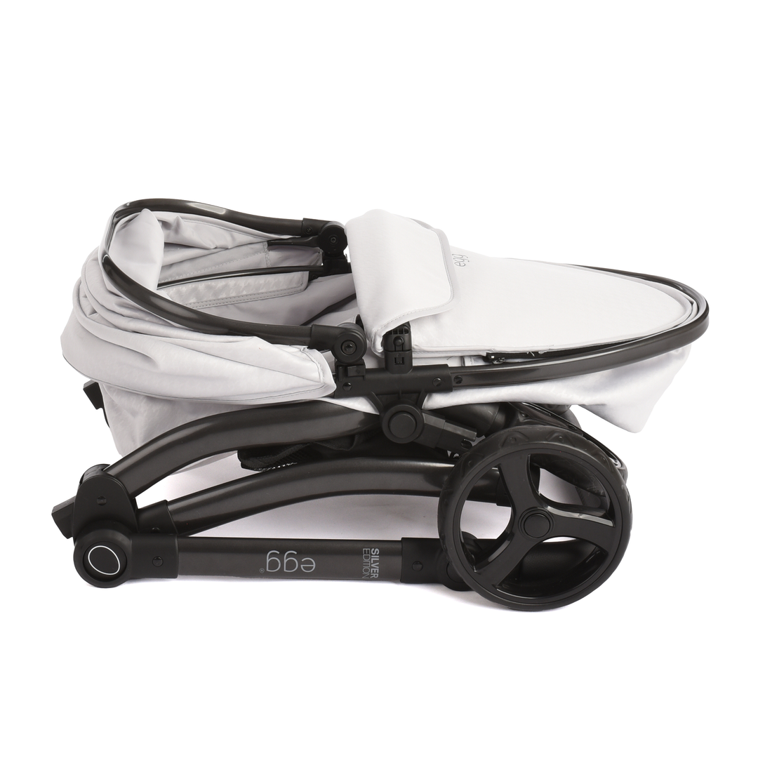 Roma Egg® Dolls Pram in Houndstooth Silver, folded flat for storage
