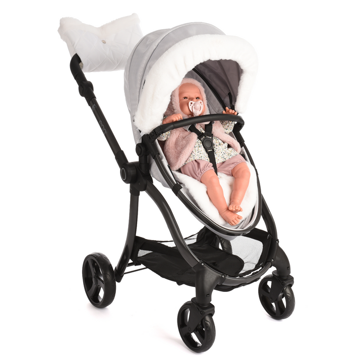 Roma Egg® Dolls Pram in Houndstooth Silver shown in seat unit mode with a doll secured in the 3-point harness (white fur accessory pack shown for styling, sold separately)