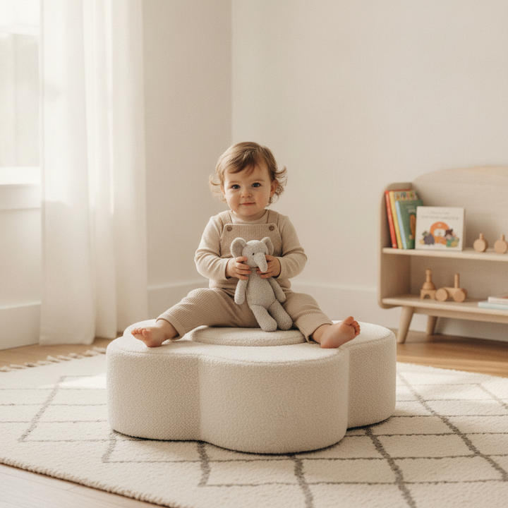 Toddler sitting on the MeowBaby Flower Shape Set foam piece in a calm nursery playroom