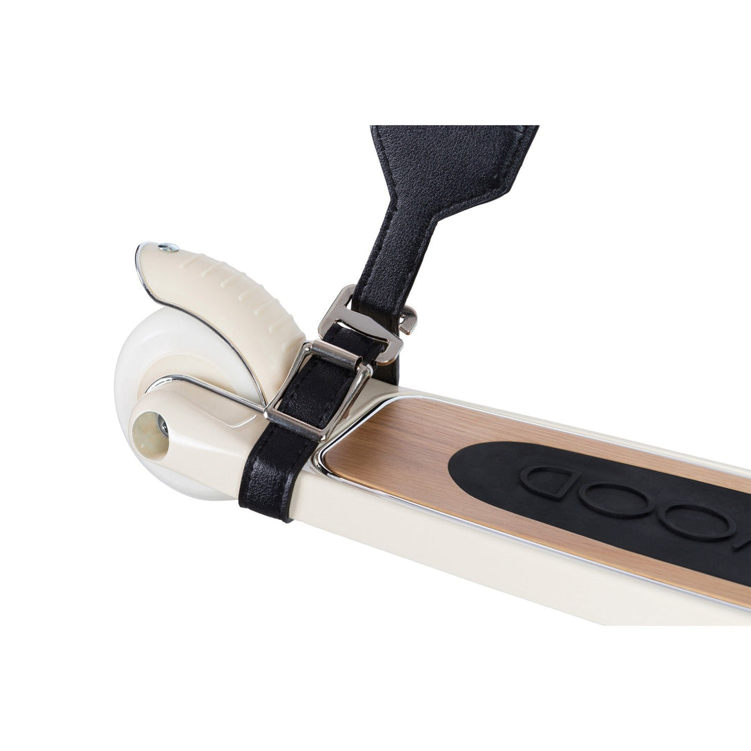 Cream scooter deck and wheel with black carry strap buckle fastening detail