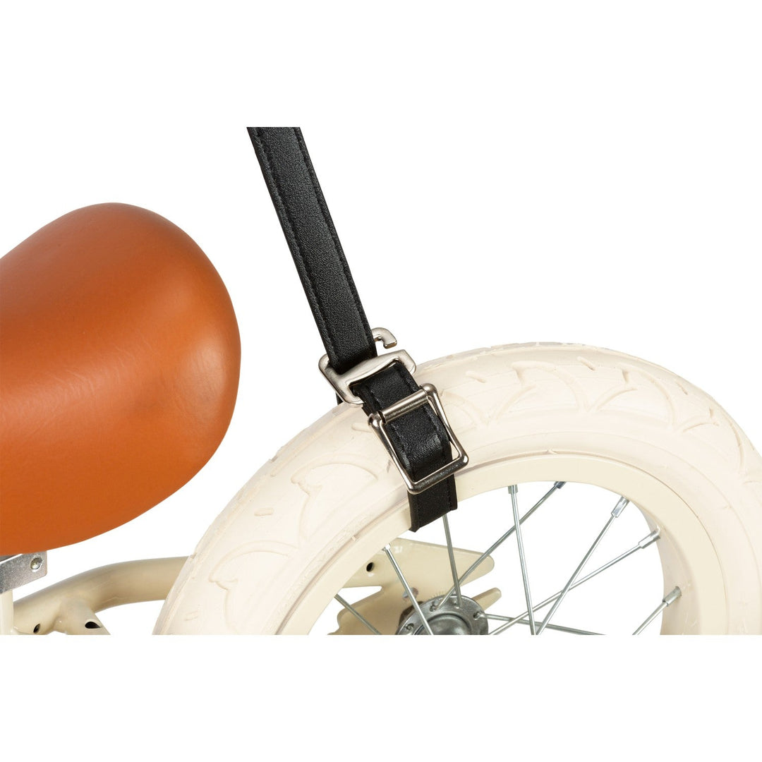 White scooter with black carry strap and balloon showing strap fastening detail