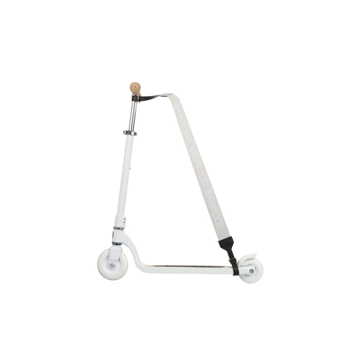 White scooter with cream carry strap hanging from stem against white background