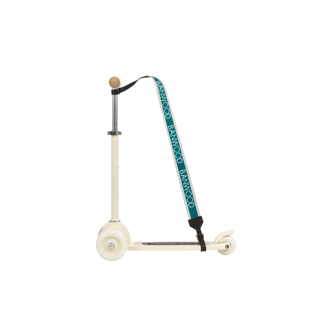 White scooter with teal carry strap in side profile, Banwood