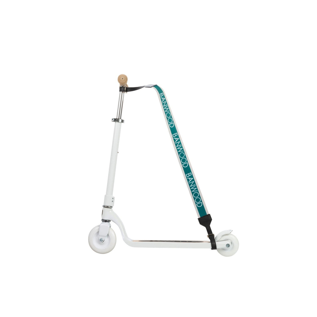 Cream wheel with teal carry strap crossing frame, Banwood