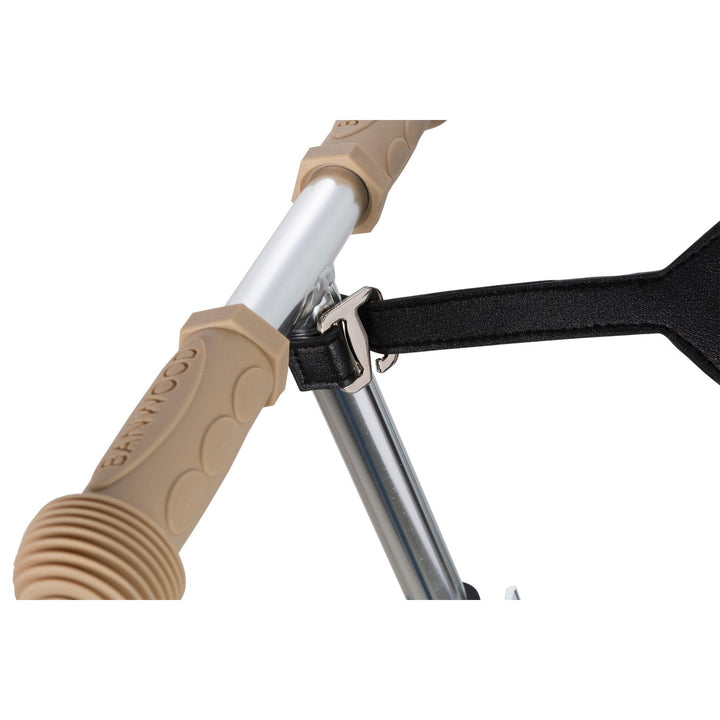 Cream scooter with teal strap visible at handlebar attachment, Banwood
