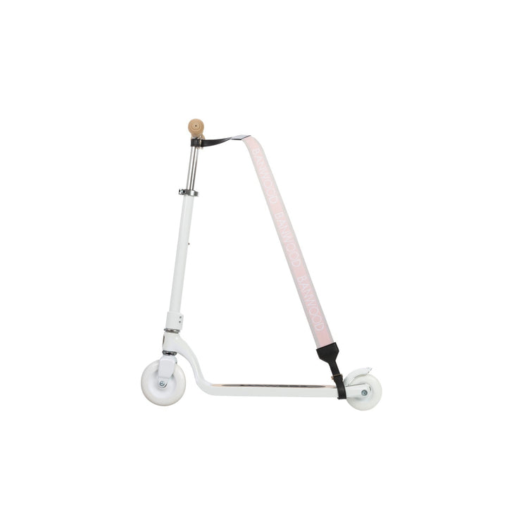 Scooter wheel with black shoulder pad and pink strap visible