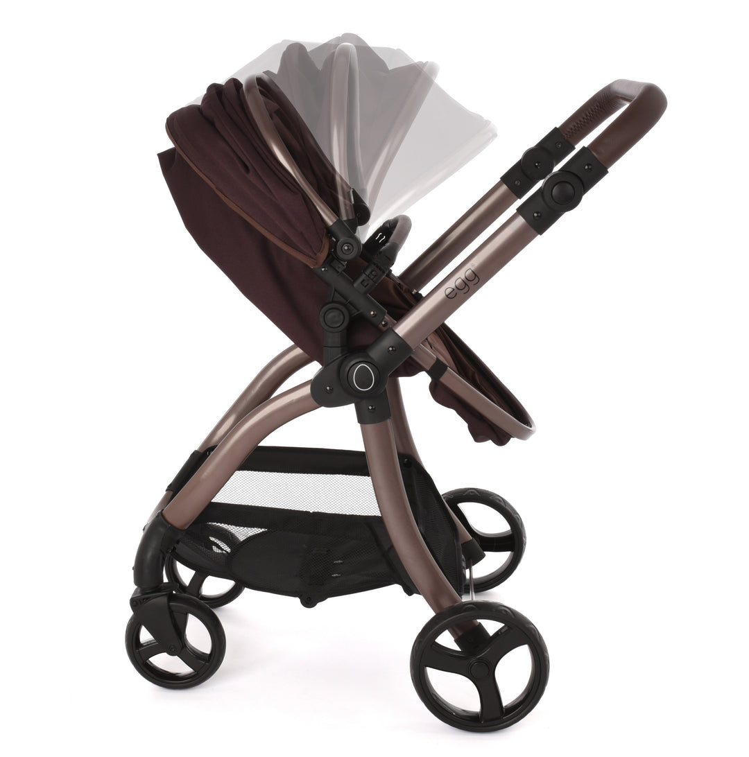Roma Egg® Dolls Pram in Mulberry, angled view of the carrycot hood and handlebar