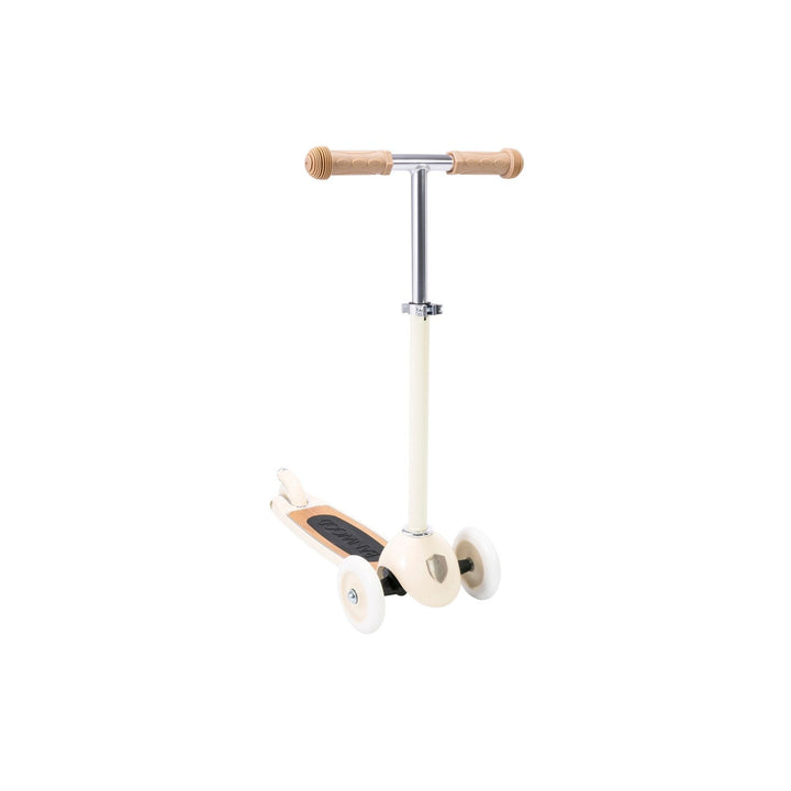 Left-side three-quarter view of cream scooter with wheels and wooden T-bar handlebar