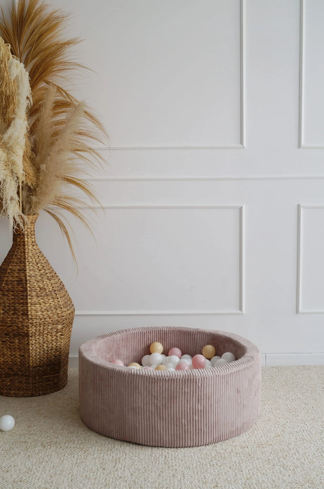 Monio for Kids Dirty Pink Corduroy Round Ball Pit — lifestyle image in nursery setting