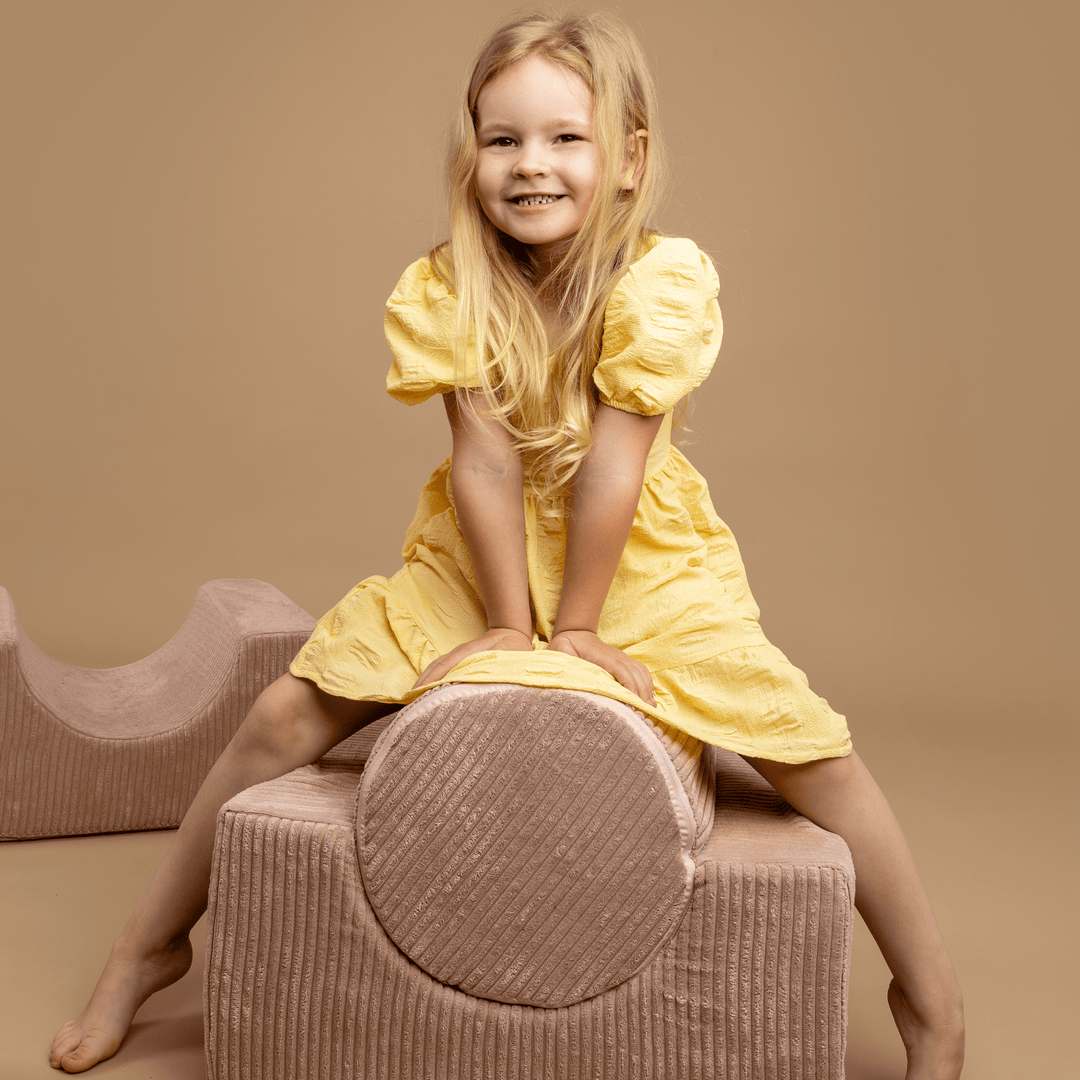 Child leaning on the MeowBaby Aesthetic Shape Set 4-Element piece, hand resting on top