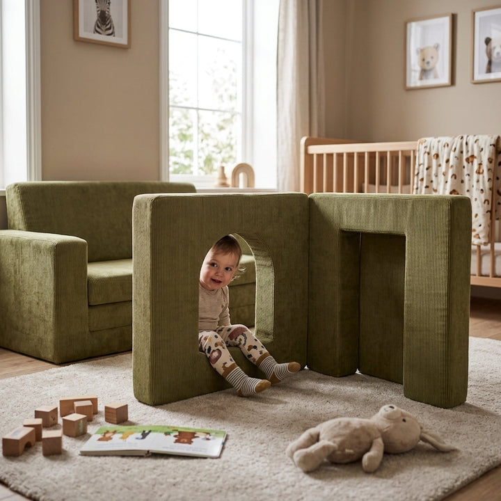 Child playing through the MeowBaby Slimcord Play Arch foam module built onto a matching Slimcord sofa