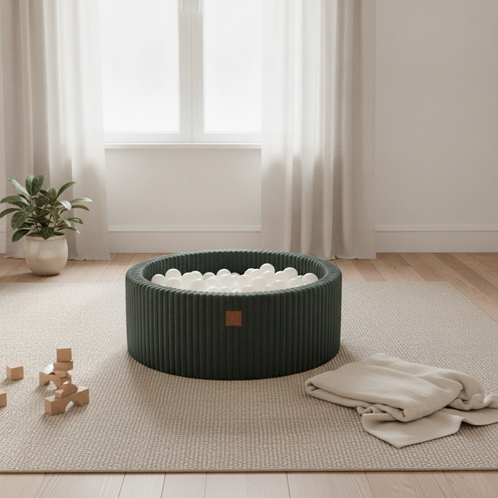 MeowBaby Pine Forest Green Churros round ball pit on a rug in a bright playroom
