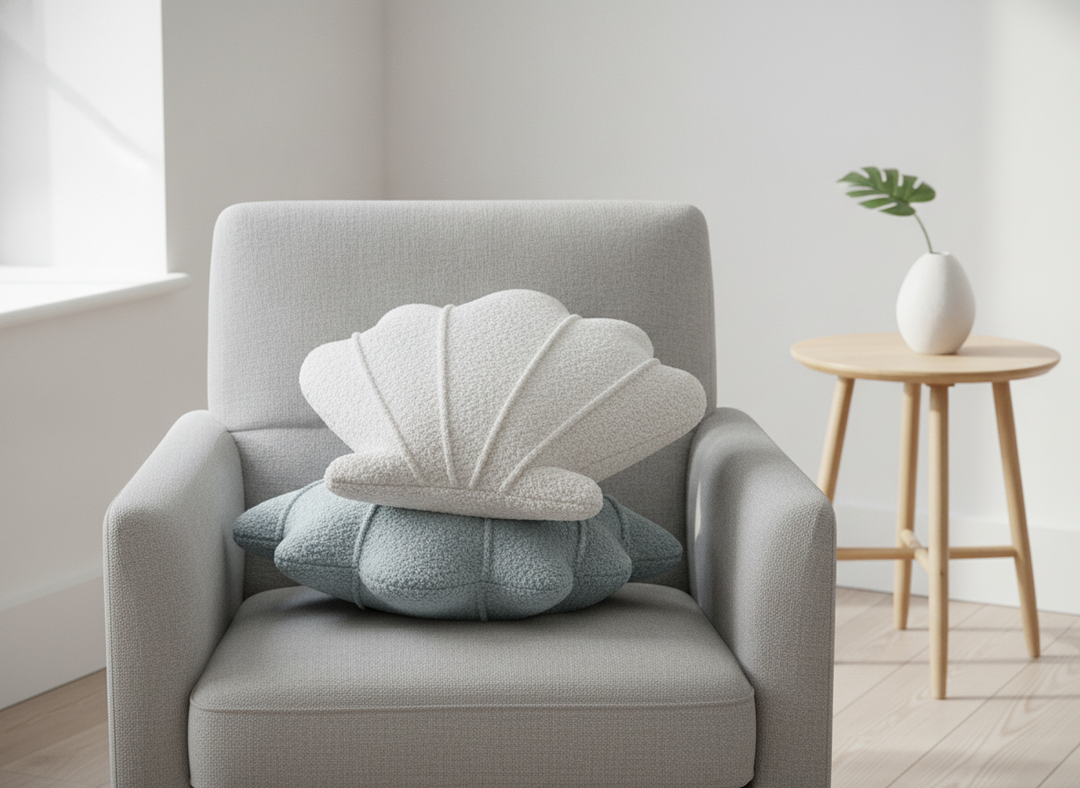 MeowBaby Shell Decorative Pillows in White and Slate Blue together on an armchair