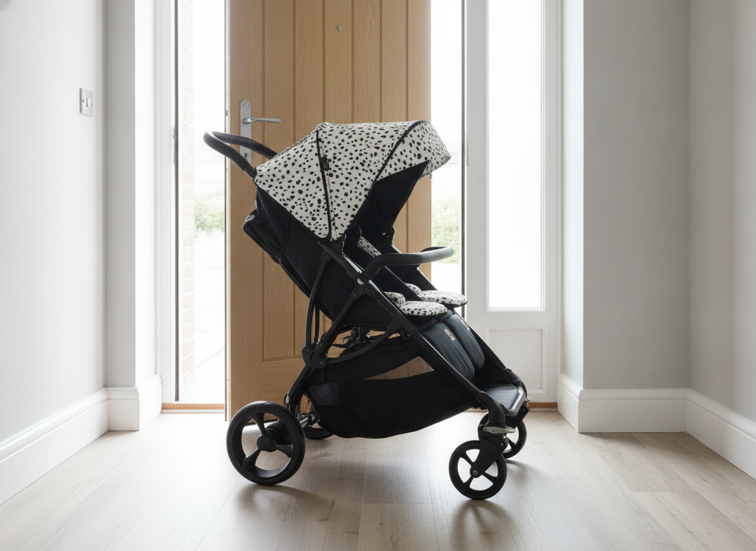 Roma Gemini 2 double pushchair in Dalmatian print fitting through a standard UK front doorway