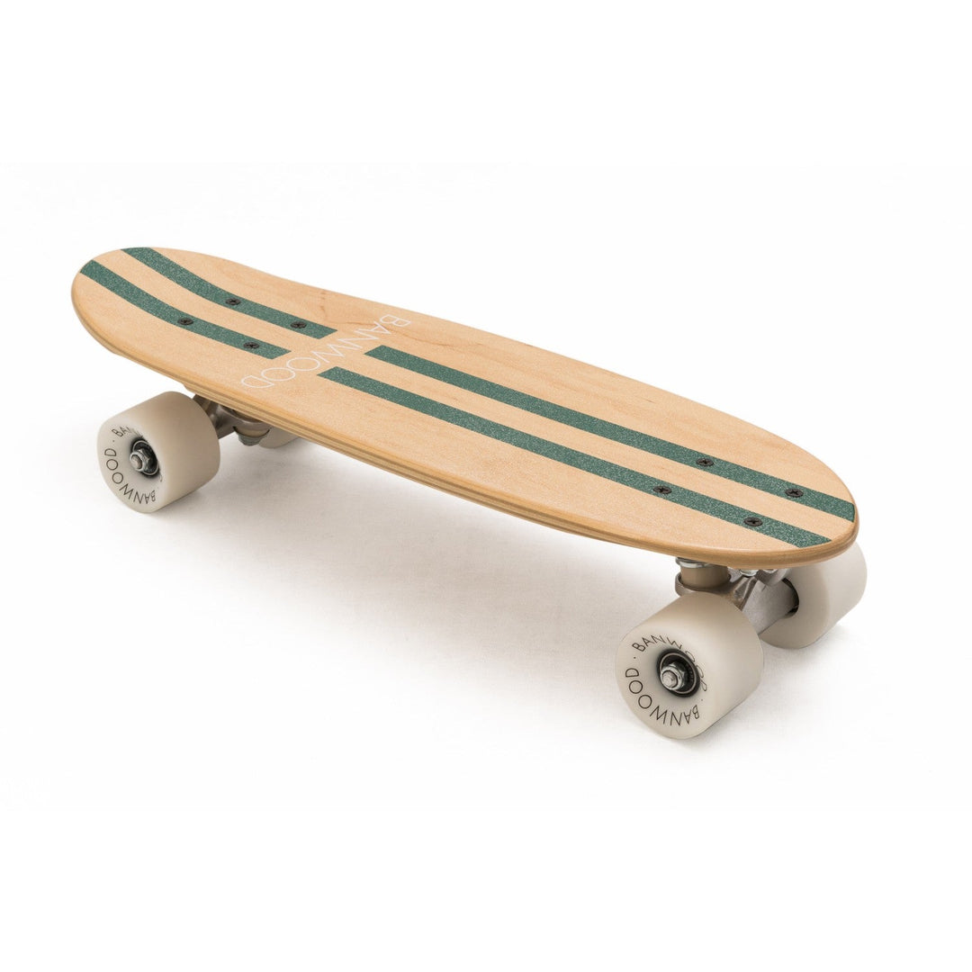 Group of friends gathered around Banwood skateboard on concrete ground