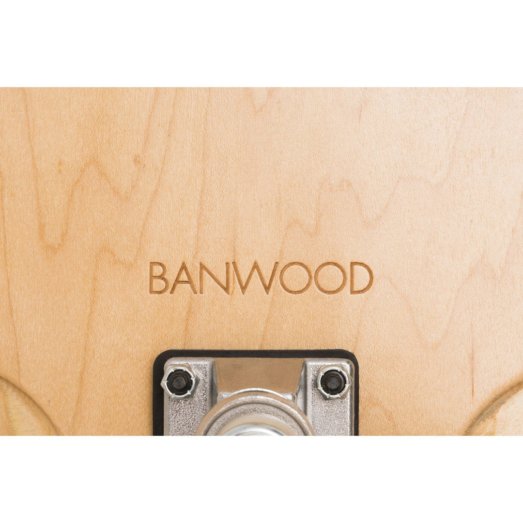 Underside detail of Banwood skateboard showing engraved logo and truck hardware